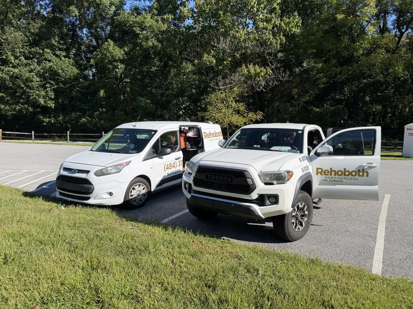 Rehoboth Pest Control van and pickup truck parked side by side